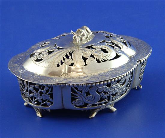 A late 19th/early 20th century Chinese pierced silver butter dish and cover, 4.5in.